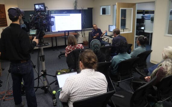 Media members and other observers gather at the Alaska Division of Elections office on Wednesday, Nov. 20, 2024,	as the results of all ballots, including ranked choice tabulations, were announced. (Mark Sabbatini / Juneau Empire)