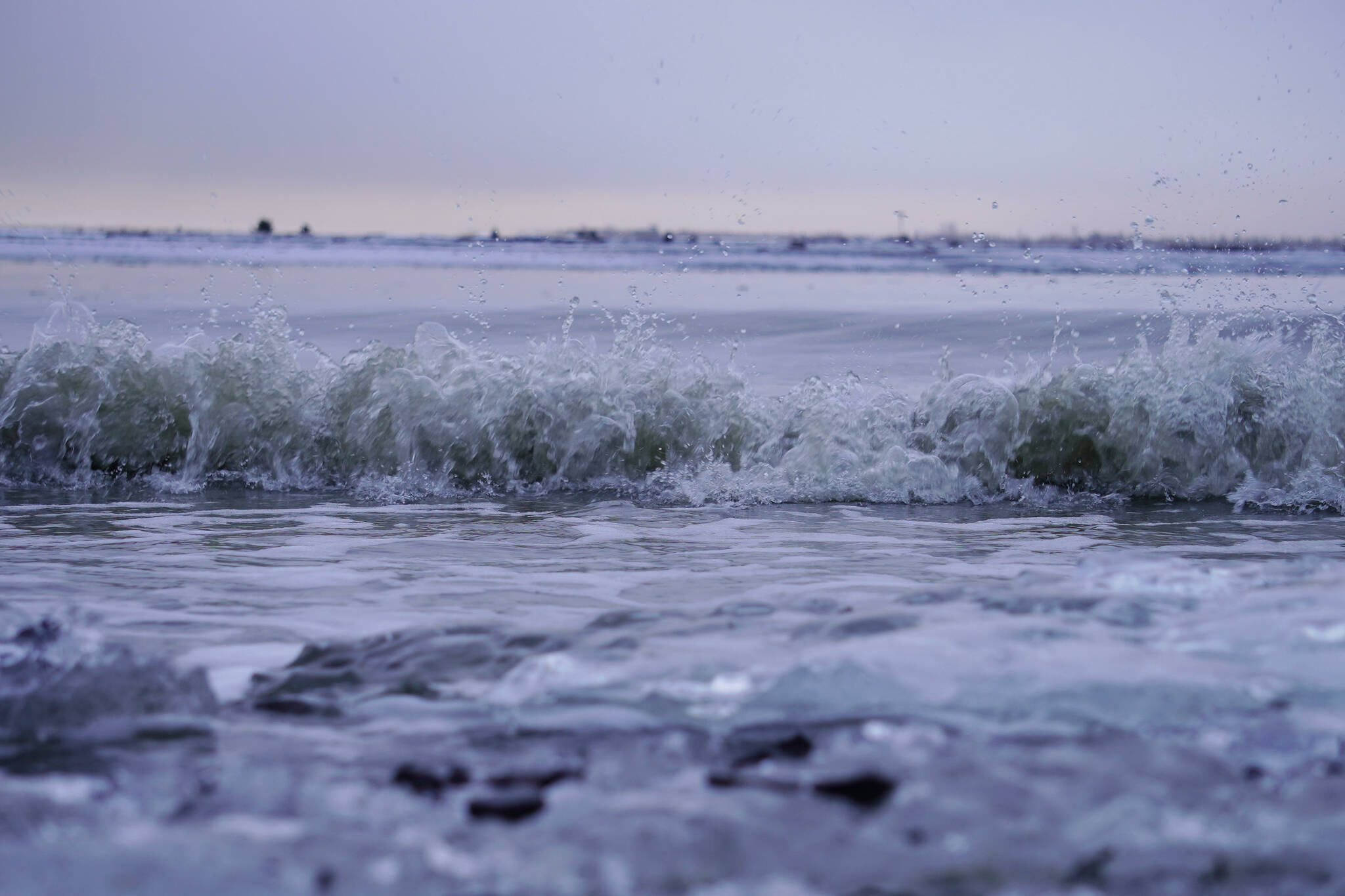 The waters of Cook Inlet crash against the shore at North Kenai Beach in Kenai, Alaska, on Tuesday, Nov. 26, 2024. (Jake Dye/Peninsula Clarion)