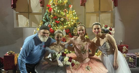 Emilie Springer/ Homer News
Ken Castner with Nutcracker senior dancers Natalia Sherwood, Tiya Martushev and Sofia Loboy in front of the Stahlbaum Christmas tree after last Sunday’s matinee performance.