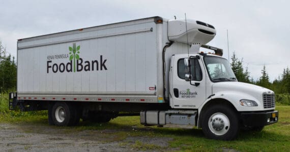 A Kenai Peninsula Food Bank truck in the Food Bank parking lot on Aug. 4, 2022 in Soldotna, Alaska (Jake Dye/Peninsula Clarion)