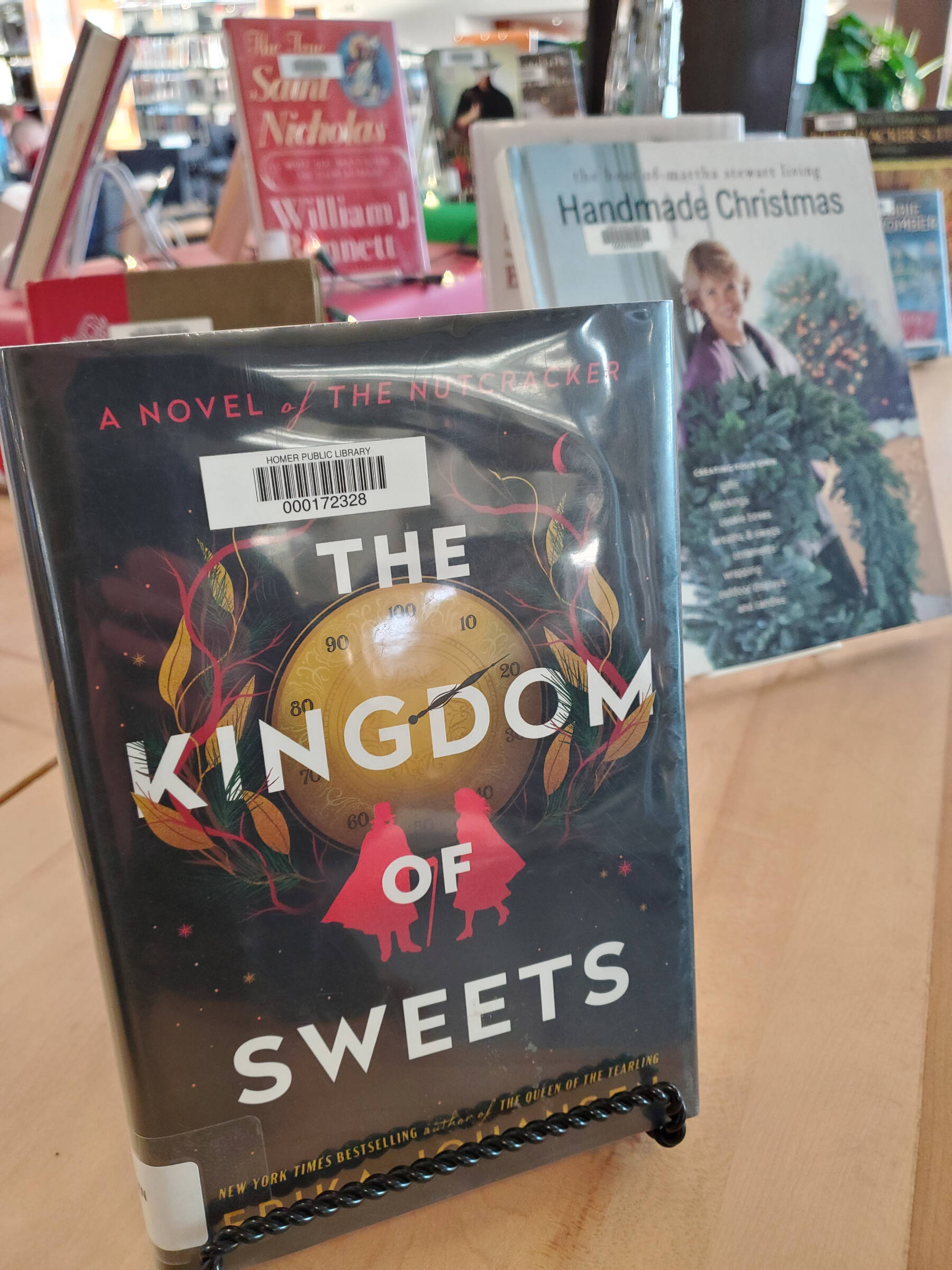 Erika Johansen’s novel, “The Kingdom of Sweets,” is part of a holiday display at the Homer Public Library in Homer, Alaska. (Delcenia Cosman/Homer News)