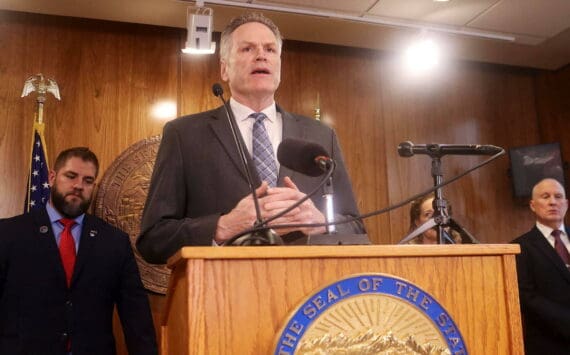 Gov. Mike Dunleavy explains details of his proposed state budget for next year during a press conference Dec. 12 at the Alaska State Capitol. (Mark Sabbatini / Juneau Empire file photo)