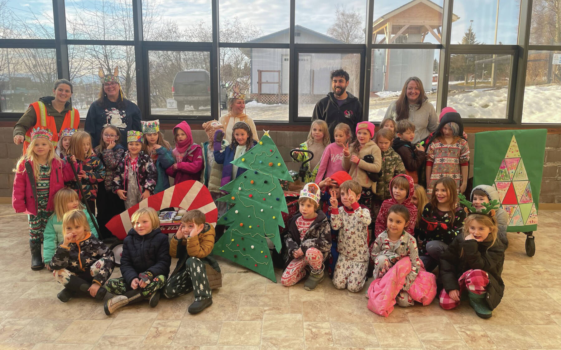 Homer’s Little Fireweed Academy students grades K-2, teachers and staff deliver donations to Homer’s Food Pantry at the Homer Methodist Church on Friday, Dec. 20. Emilie Springer/ Homer News