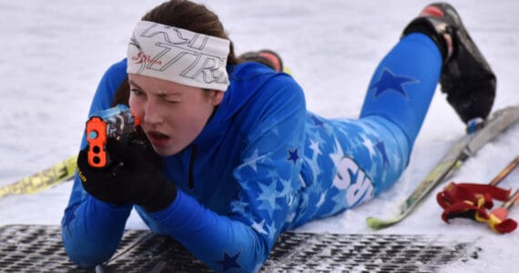 Soldotna's Inga Smith aims at the Candy Cane Scramble on Friday, Dec. 20, 2024, at Tsalteshi Trails just outside of Soldotna, Alaska. (Photo by Jeff Helminiak/Peninsula Clarion)