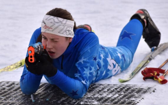 Soldotna's Inga Smith aims at the Candy Cane Scramble on Friday, Dec. 20, 2024, at Tsalteshi Trails just outside of Soldotna, Alaska. (Photo by Jeff Helminiak/Peninsula Clarion)