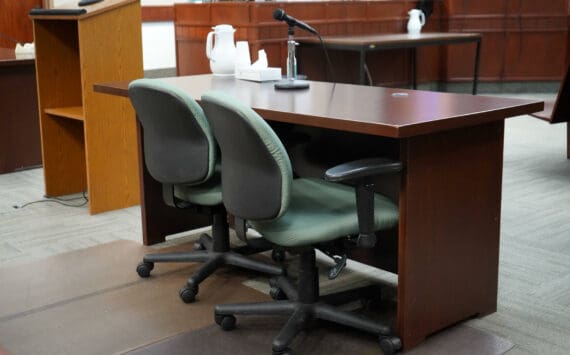 A table used by parties to a case sits empty in Courtroom 4 of the Kenai Courthouse in Kenai, Alaska, on Wednesday, Dec. 11, 2024. (Jake Dye/Peninsula Clarion)