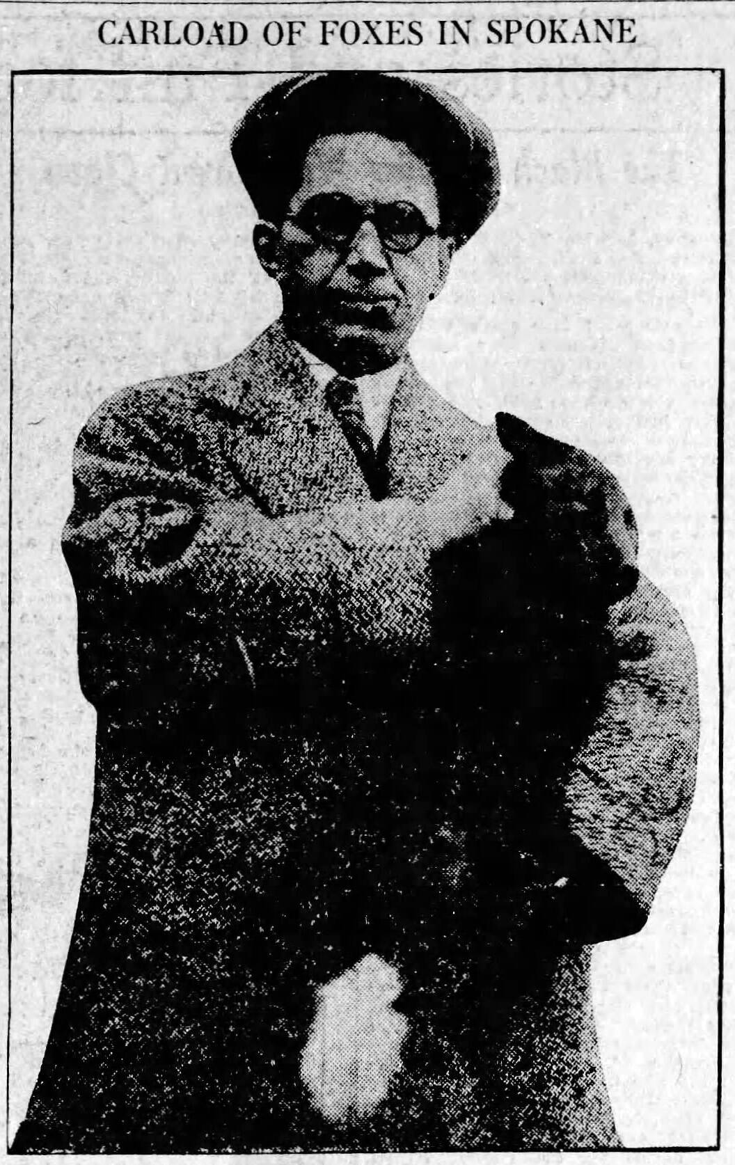 This Nov. 21, 1925, photograph from the Spokane Chronicle shows Keith McCullagh with one of the farm-raised foxes he was transporting to Sweden.