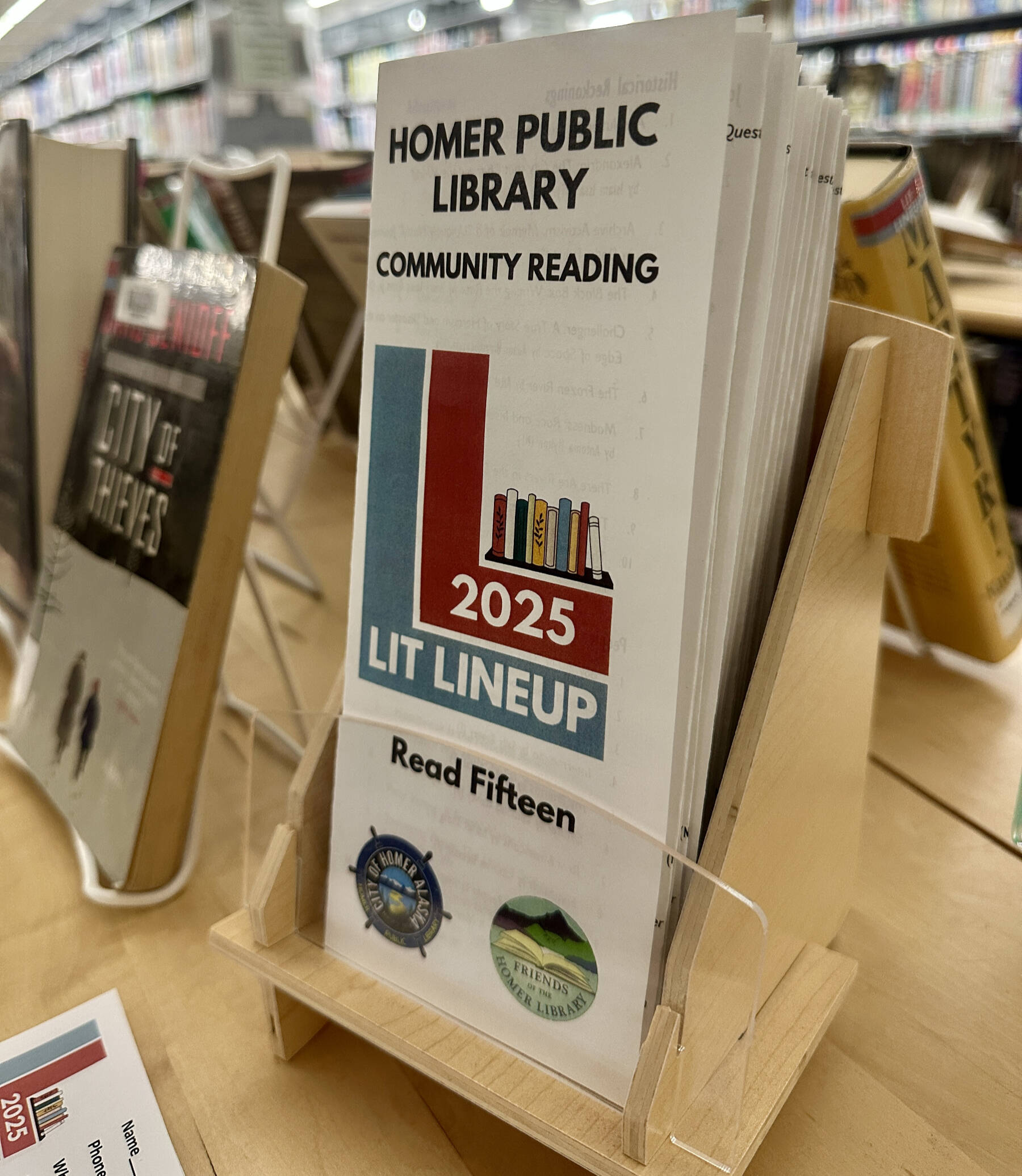 Brochures for the 2025 Lit Lineup are available at the front desk of the Homer Public Library and the lineup’s display, photographed on Friday, Jan. 3, 2025, in Homer, Alaska. Photo by Christina Whiting