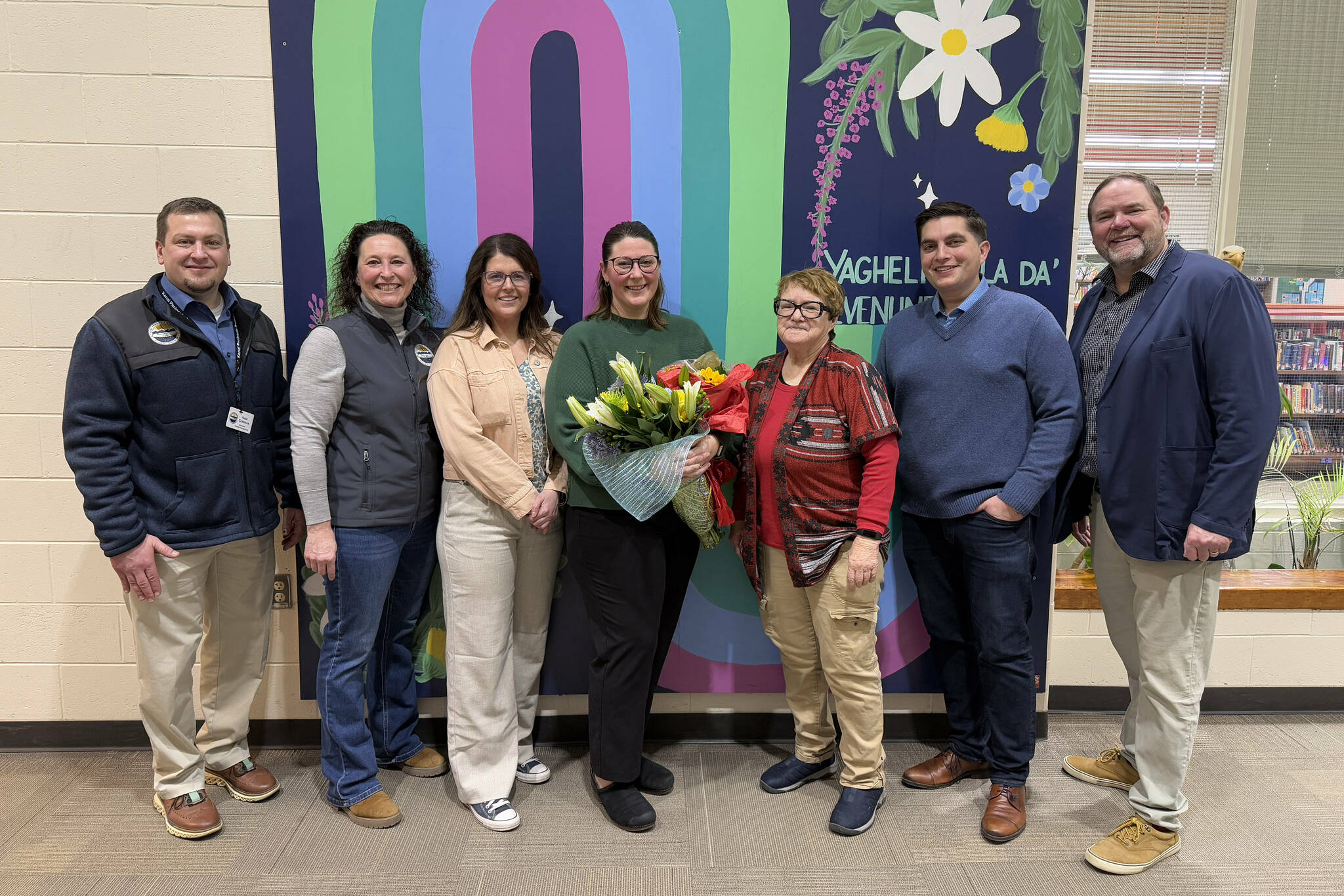 KPBSD Human Resources Director Nate Crabtree, KPBSD Assistant Superintendent Kari Dendurent, Nikiski North Star Principal Jenna Fabian, Mountain View Assistant Principal Aubrie Ellis, KPBSD Board of Education Member Patti Truesdell, Rep. Justin Ruffridge and KPBSD Superintendent Clayton Holland stand for a photo after Ellis was named National Outstanding Assistant Principal of 2025 by the Alaska Association of Elementary School Principals at Mountain View Elementary School in Kenai, Alaska, on Friday, Jan. 10, 2025. (Jake Dye/Peninsula Clarion)