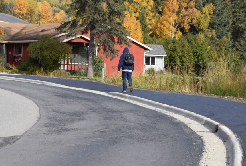 <p>A local community member walks up Ben Walters Lane on a newly completed sidewalk on Monday, Sept. 30, 2024, in Homer, Alaska. The City of Homer was recently awarded a federal grant for the city’s continued efforts in establishing nonmotorized transportation access. (Delcenia Cosman/Homer News file)</p>