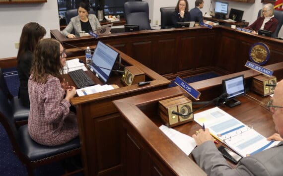 Kate Sheehan (left foreground), director of the Alaska Division of Personnel and Labor Relations, and Paula Vrana, commissioner of the Alaska Department of Administration, discuss an ongoing statewide salary study during a House State Affairs Committee meeting Thursday, Jan. 30, 2025, at the Alaska State Capitol. (Mark Sabbatini / Juneau Empire)