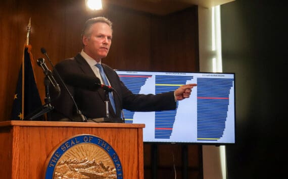 Gov. Mike Dunleavy compares Alaska to Mississippi data on poverty, per-pupil education spending, and the 2024 National Assessment of Education Progress fourth grade reading scores during a press conference on Jan. 31, 2025. Alaska is highlighted in yellow, while Mississippi is in red. (Jasz Garrett / Juneau Empire)