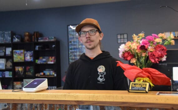 Co-owner Derek Benson stands behind the counter on The Gilded Table’s first day open in their new space in Unit 105 at 345 Sterling Highway Road on Tuesday, March 4, 2025. (Chloe Pleznac/Homer News)